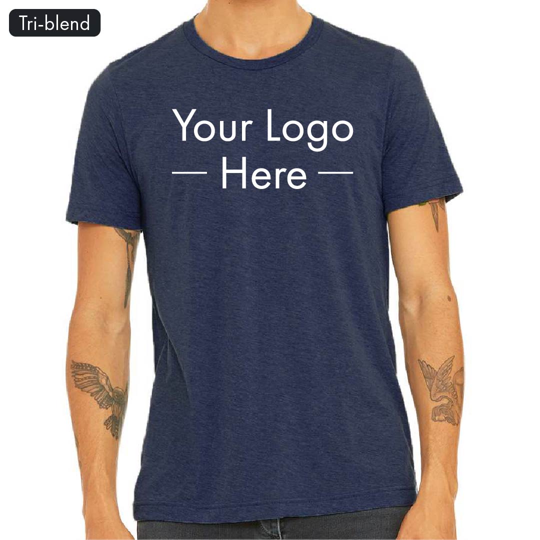 Front view of a navy Bella Canvas 3413 tri-blend t-shirt with placeholder text reading "Your Logo Here" on a male model with tattooed arms