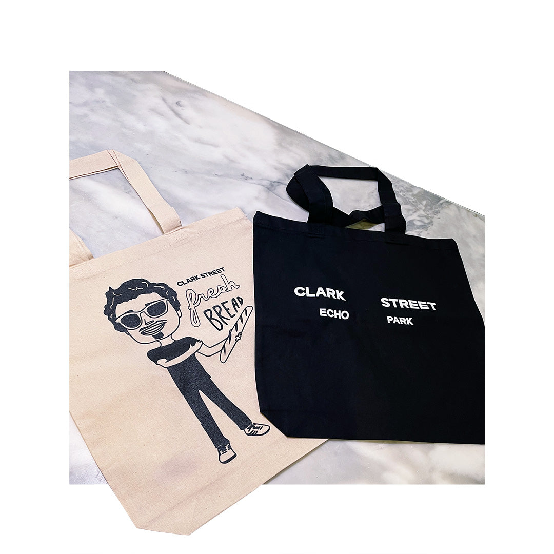 Canvas tote bags for Clark Street Bread featuring custom cartoon artwork and Echo Park text print