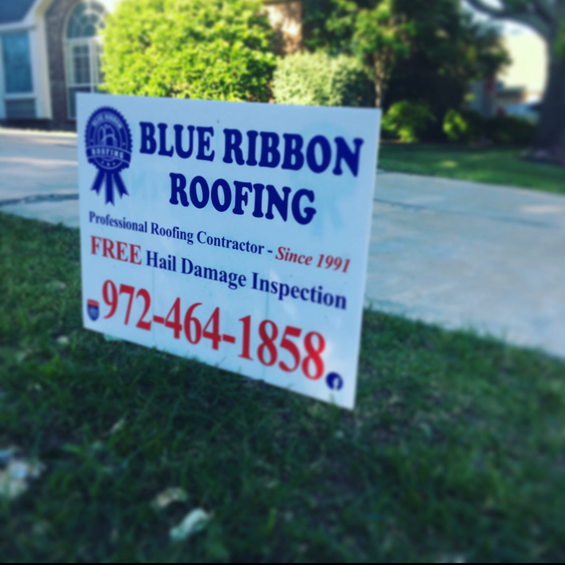 Durable lawn sign for Blue Ribbon Roofing promoting hail damage inspections and roofing services since 1991
