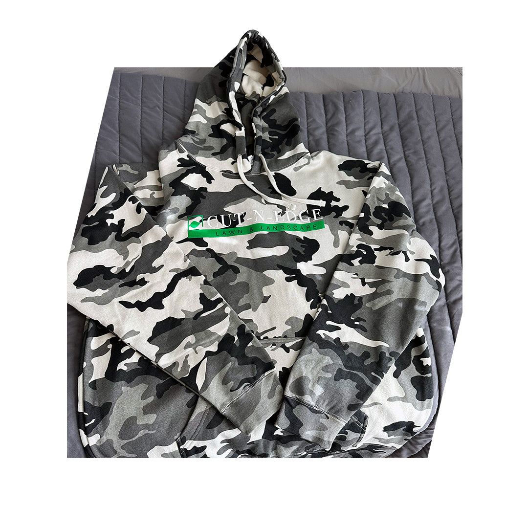 Independent Trading Co. heavyweight camo hoodie with Cut-N-Edge Lawn and Landscape logo printed on front.