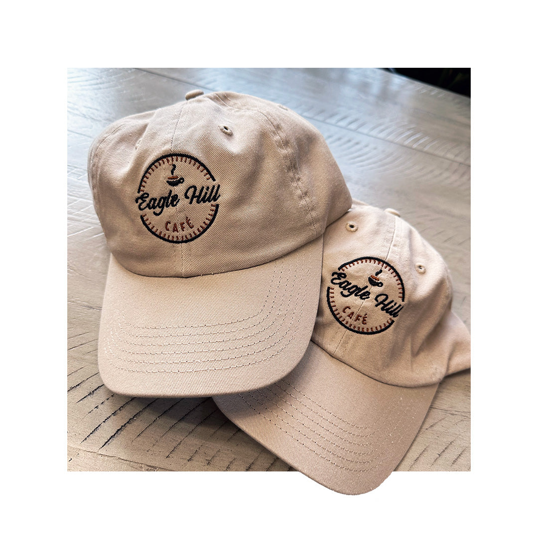 Pair of tan custom embroidered "Eagle Hill Café" dad hats – Valucap VC300a