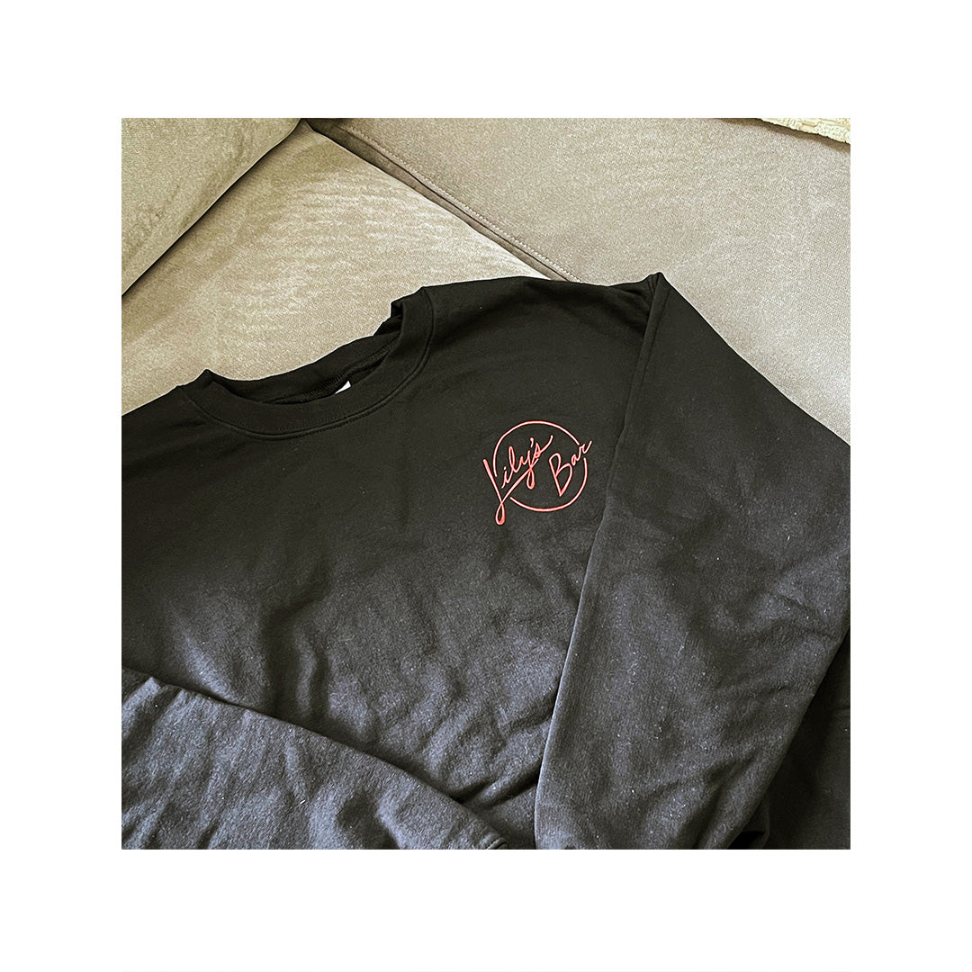 Custom printed black Gildan sweatshirt with small red “Lily’s Bar” front chest logo