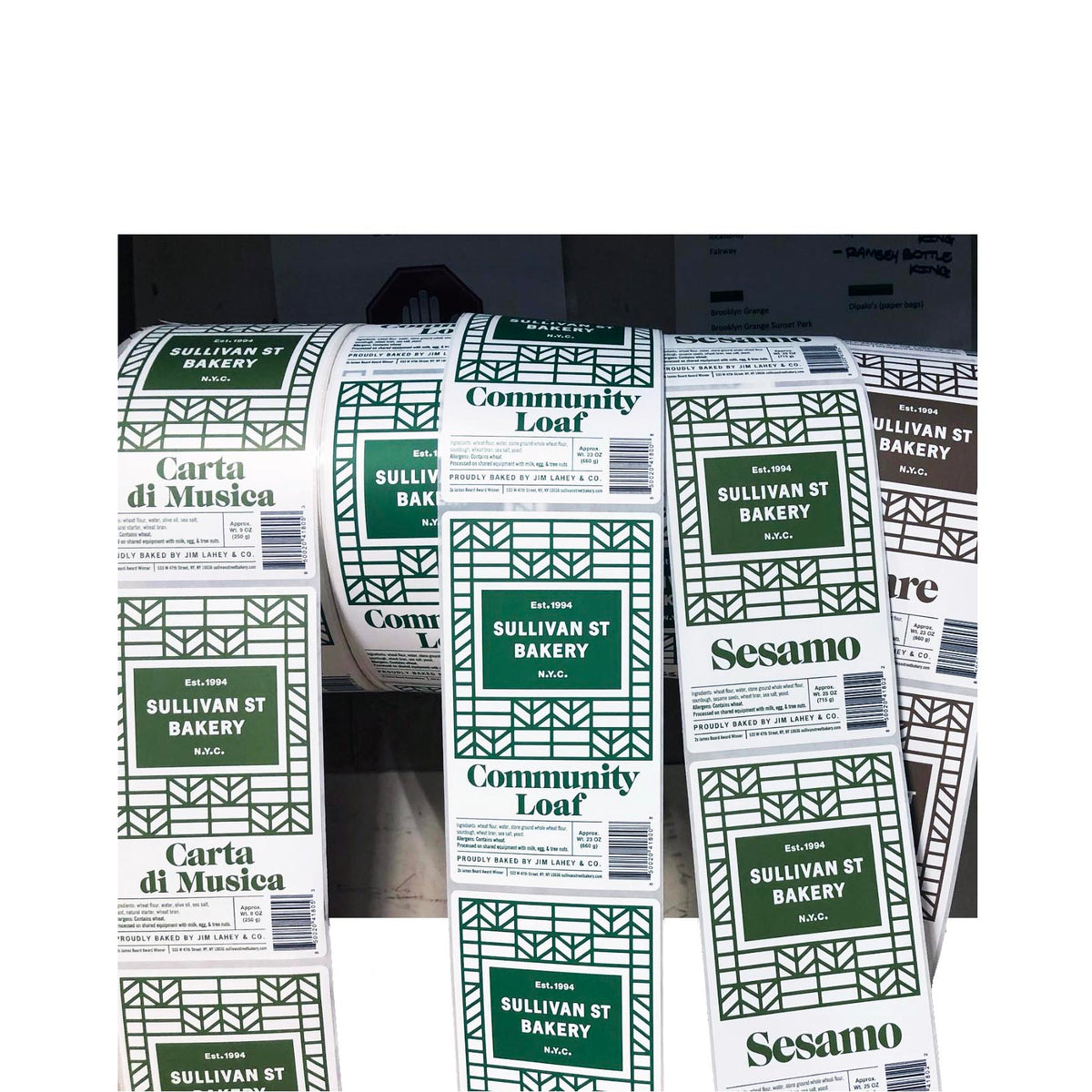 Custom rectangle labels for Sullivan Street Bakery in NYC, printed on rolls with green and brown geometric branding for multiple bread products