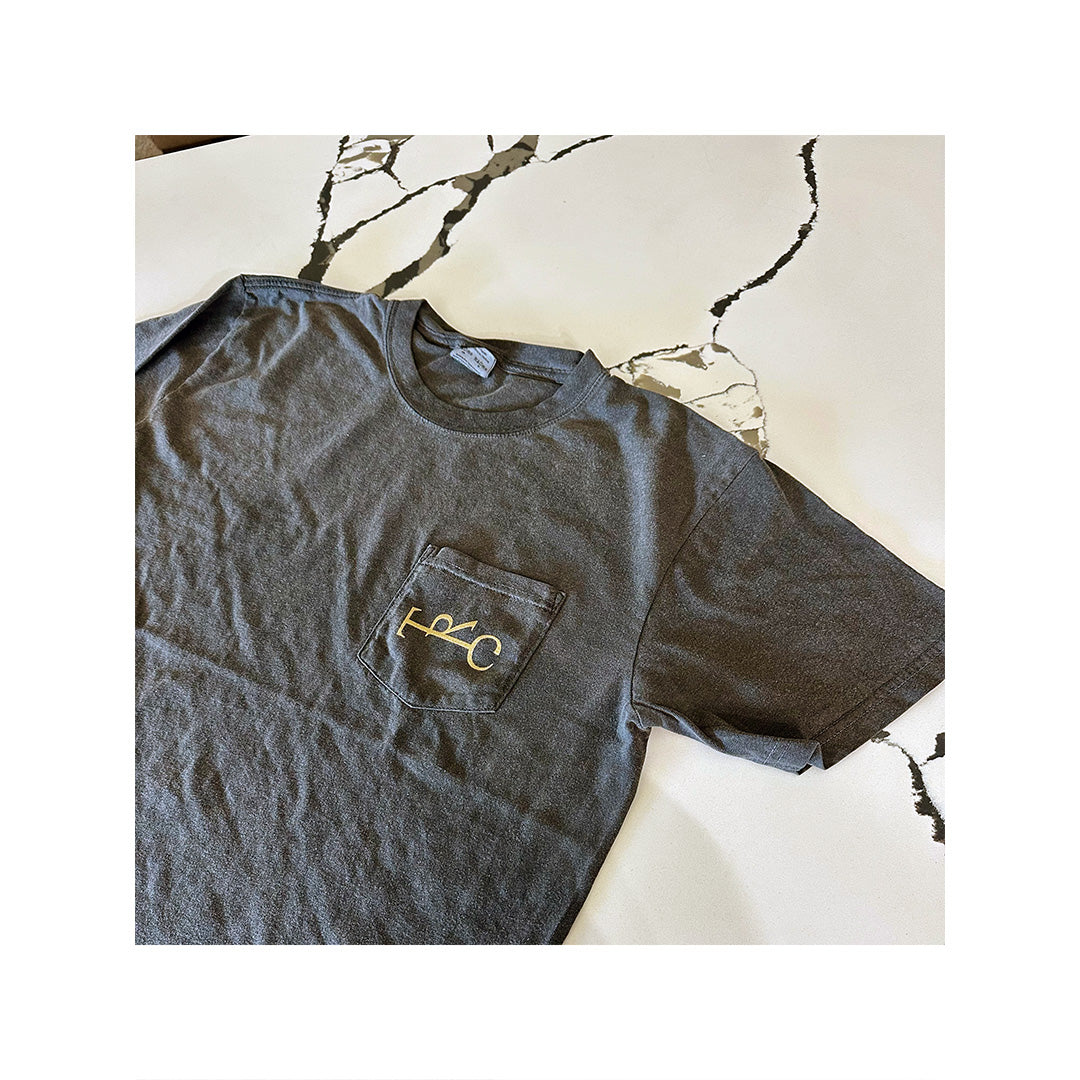 Comfort Colors 6030 pocket tee with gold custom logo printed on left chest for The Rhymer’s Club
