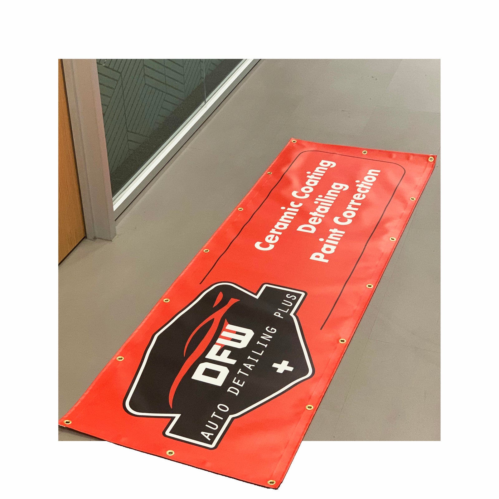 Premium outdoor vinyl banner for DFW Auto Detailing Plus, featuring bold colors, grommets, and durable hemmed edges.