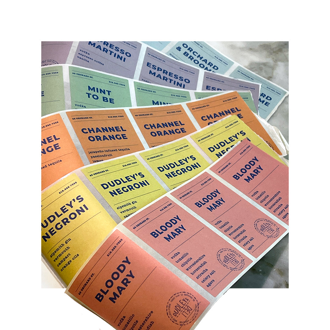 Sheet of custom cocktail bottle labels for Dudley’s and Channel Orange drinks