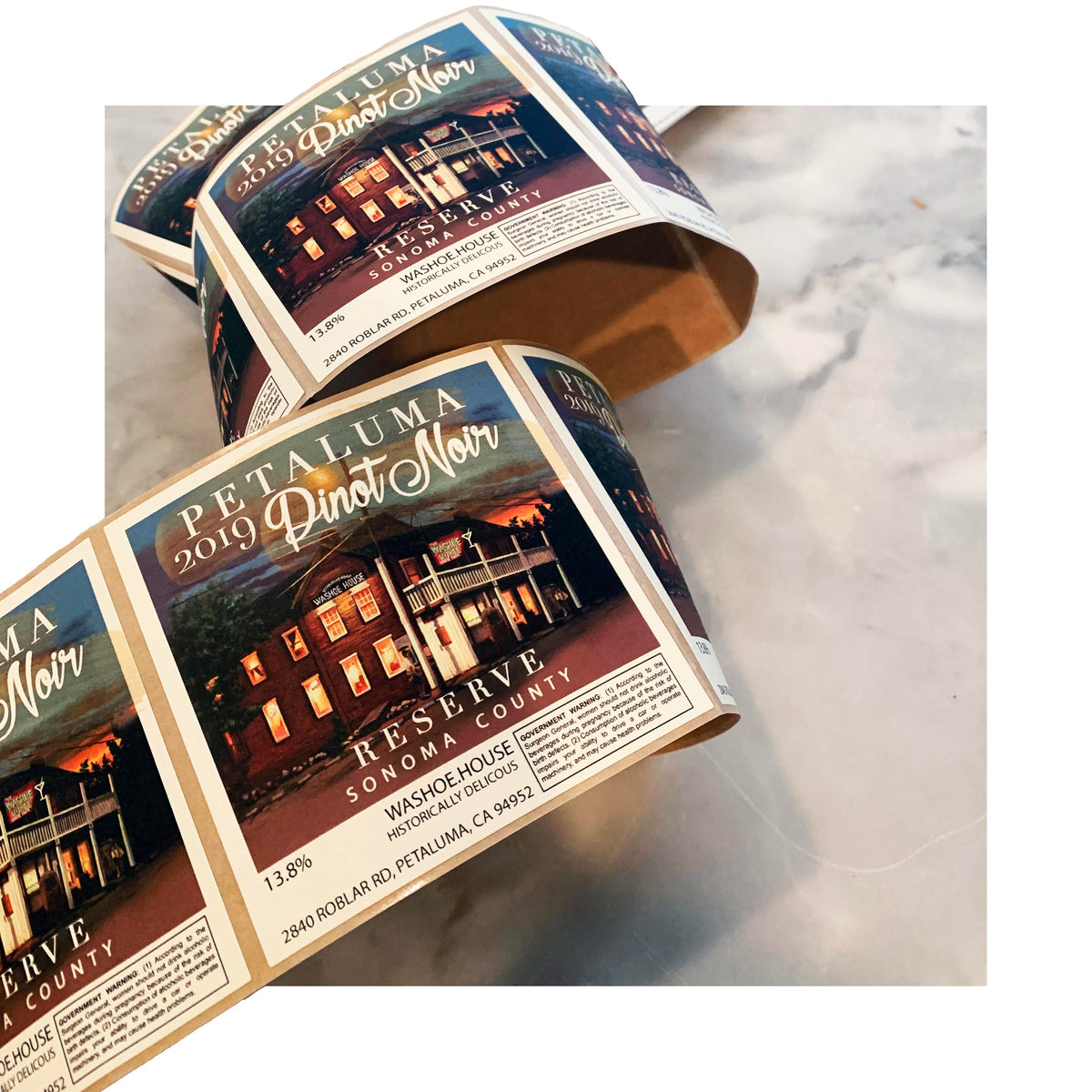 Roll of Petaluma Pinot Noir wine labels with illustrated vineyard design